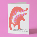 Greeting card with a dinosaur illustration on a pink background